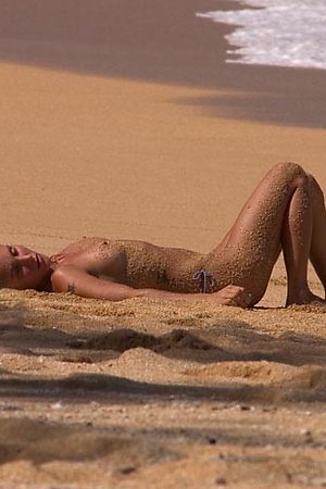 Naked hotties enjoy posing on the beach