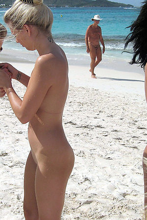 Naked girl and nude pussy on the beach