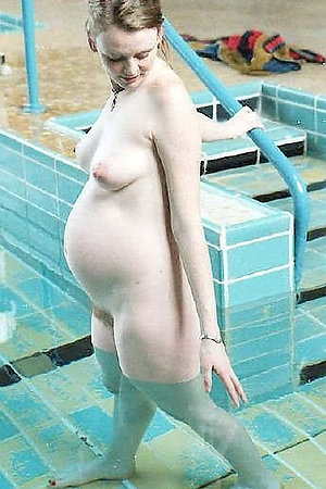 Pregnant amateur nudists visiting a water pool