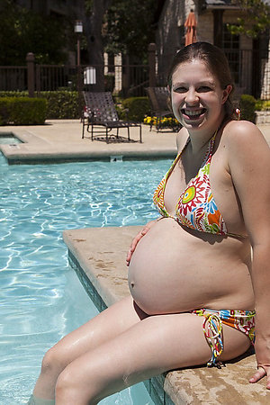 Pregnant nudist and naturist girls in a pool