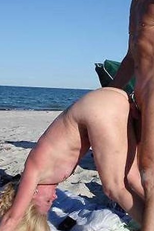 Sexy babe sucks huge dick on a beach