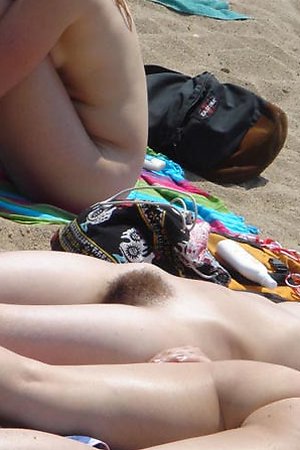 Spy on nude babes on the beach