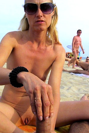Lovely girls bare their bodies on the beach
