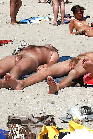 Perfect babes sunbathes nude on the beach