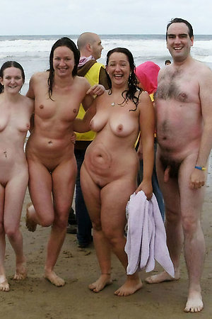 Nudist people with age difference posing together
