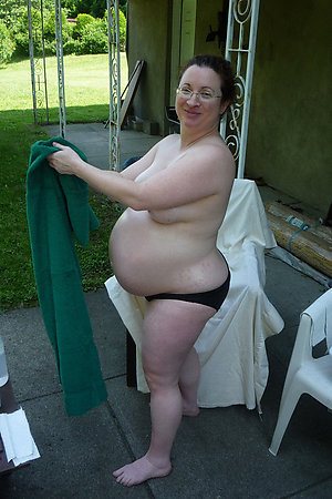Nudist pregnant women posing for camera